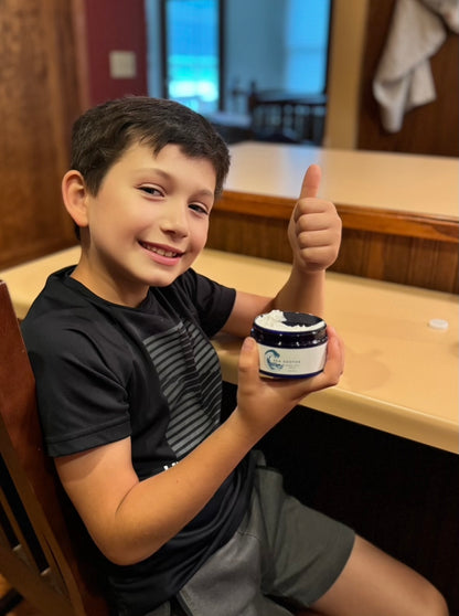 Boy holding a jar of Sea Soothe